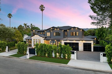 Beautiful house is situated on the corner of the street in the affluent neighborhood