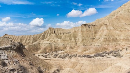 Fototapeta na wymiar Panoramic desert view of stone and sand dunes.
