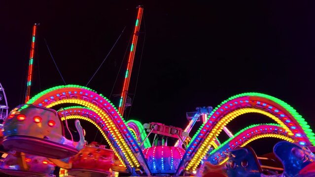 Neon Carnival Nights: Brightly Lit Amusement Park After Dark