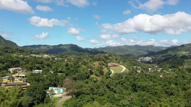 Drone footage over the mountain town of Comerio on a sunny day in Puerto Rico