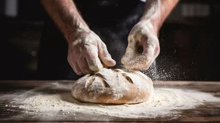 Gartenposter Brot Close up of hands dust bread with flour while baking in bakery