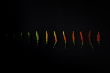 chilli peppers on black background. Top view. Hot pepper flat lay. Chili wallpaper