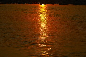 Stunning pastel sunset, gliding peacefully along the water's surface