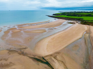 Aerial view of the coastline and beach of Traeth Lligwy on the island of Anglesey in North Wales in the United Kingdom