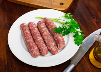 Delicious butifarra on plate with herbs and olive oil on table. Spanish dish