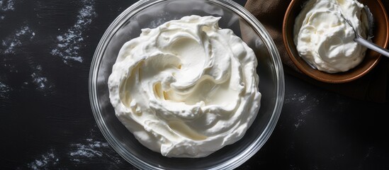 Fototapeta premium Whipped cream for cakes both regular and vegan in glass bowls