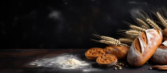 Papier Peint photo Lavable Pain Country style bread or French baguette wheat and flour on blackboard Rural kitchen or bakery background with space for text