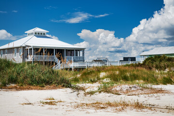 Fototapeta na wymiar Summer houses on stilts on the Atlantic Ocean in North Carolina.
