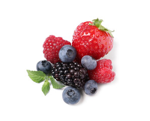 Many different ripe berries and mint leaves isolated on white