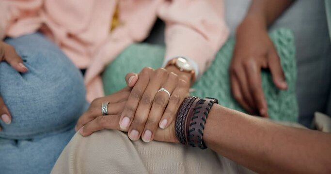 Empathy, support and a couple holding hands in solidarity during pain, grief or loss for comfort and care closeup. Love, help or trust with a man and woman at home for healing, kindness or respect