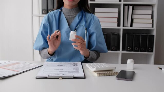 woman doctor talking online with patient, making video call, looking at camera, young female wearing white uniform with stethoscope speaking, consulting and therapy concept