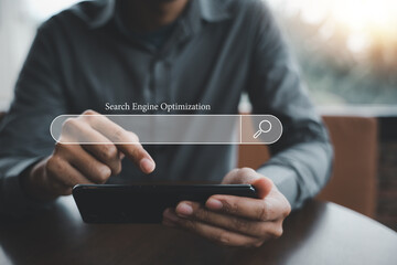 Businessman using smartphone to optimize online content with SEO tools. Technology and business concept. search engine optimization with search bar