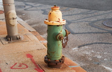 fire hydrant stands tall on a sunny street corner, ready to protect and symbolize safety in urban environments