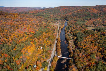 Panoramic aerial view of covered bridge over river along New Hampshire and Vermont state line...