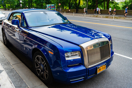 New York City, USA - July 7, 2023: 2008 Rolls-Royce Phantom Drophead Coupe blue car parked front passenger side view