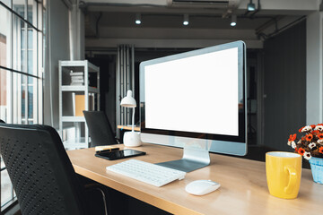 Empty computer monitor screen for design mock up template in modern small office interior or home office. Stylish workplace for creative occupation. Jivy