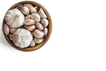 Garlics in wooden bolw  on white wooden planks background.  have path
