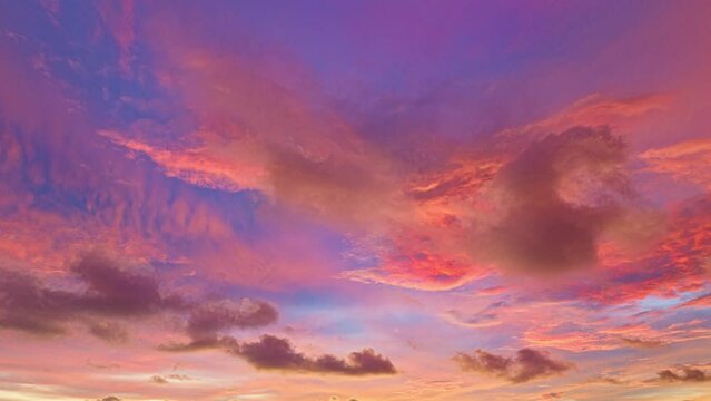 Time lapse scene romantic pink sky on sunset above the ocean.
Sunset with bright red light rays and other atmospheric effects.
colorful cloud in bright sky. Sky texture abstract nature background.
