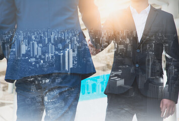 Mixed media effect Double exposure businessman handshake business deal to partner successfully negotiated and commercial cooperation and trade cityscape blurred background.