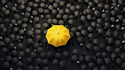 Bird's eye view of a vibrant yellow umbrella standing out amidst a sea of black umbrellas in a...