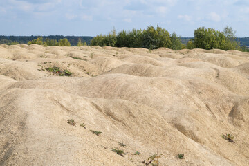 Bizarre relief on the waste heap of the old Bornitsky quarry on a September day. Gatchina district, Leningrad region. Russia