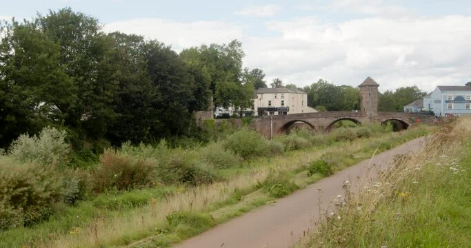 Wide shot of Monnow Bridge next to Monnow river