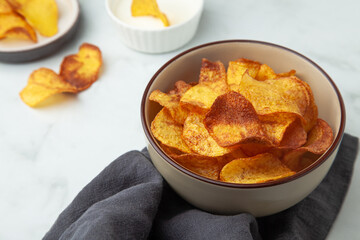 Homemade potato chips with garlic sauce