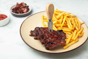 Pork ribs bbq with fries and ketchup