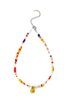 Close-up shot of a handmade beaded necklace with a smiley face and with a lobster clasp. Chain of multi-colored beads is isolated on a white background. Handmade jewelry made out of beads. Front view.