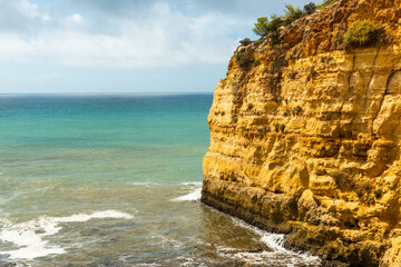 Cliffs and beach at Algarve coast in Portugal