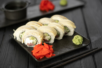 Sushi set with caviar, avocado and salmon. Asian cuisine. Top view. Free space for your text.