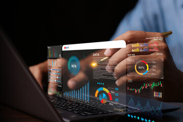Data analyst working on business analytics dashboard with charts, with KPI and metrics connected to the database for technology finance, operations, sales, marketing