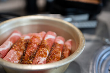 Close up of ready to grill set of meat as pork or beef. Traditional Korean slice pork or slice beef with sauce in stainless steel bowl at Korean barbecue restaurant. Traditional Asian food concept. - 650558594