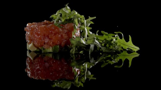 Garnish is dropped on the food