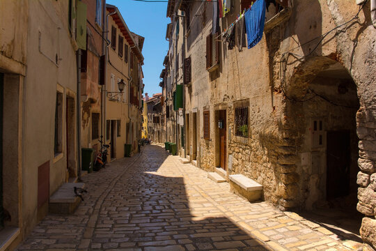 Fototapeta A quiet back street in the historic centre of the medieval coastal town of Rovinj in Istria, Croatia