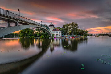 Sunset in Berlin with colorful sky. Bridge over the Spree to the Insel der Jugend in the evening in...