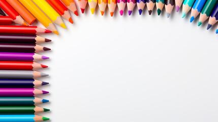 Fototapeta premium Colored pencils arranged with copy space for text, word, back to school and educational concept
