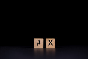 hashtag icon next to X on black background