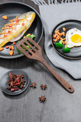 Wooden spatula, kitchen supplies made of wood, indoor shot, placed with food