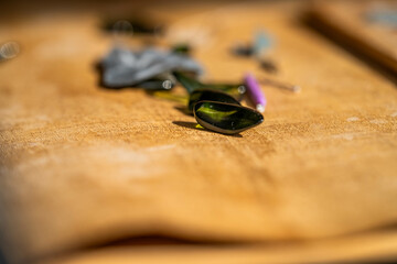 making grass and shell jewellery with tools in a workshop