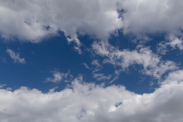 blue sky between two clouds