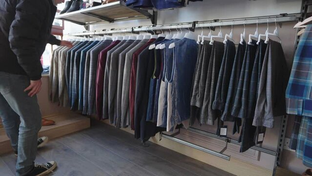 Shopping for outfit. Traditional Scottish kilt made of distinctive tartan pattern