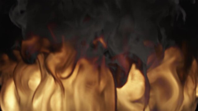 A strong flame of fire close up in loop. Can be used as a video texture or background for design projects, scenes, etc.
