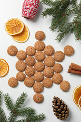 Obraz na płótnie Canvas Delicious, Dutch Pepernoten Christmas cookies with a Christmas tree branch