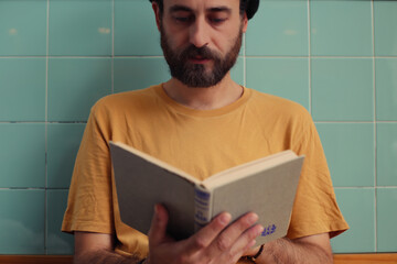 Man reading a book. Close-up.