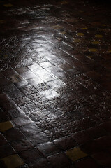 Polished floor inside of the Malbork castle in Poland. Dark, specular reflection, tile, gothic tiles.