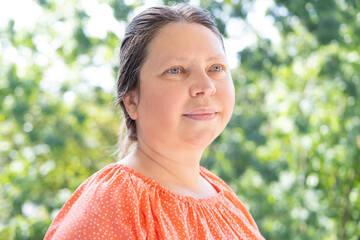 close up female face, pretty caucasian woman 40-45 years old smiling, age-related changes, concept...