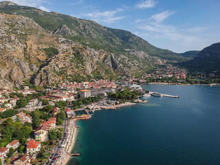 Aerial perspective of Kotor, Montenegro, surrounded by mountains and nestled by a picturesque bay