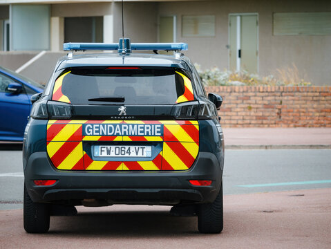 Neufchatel-Hardelot, France - Aug 18, 2023: Situated In Front Of A House With A Brick Fence In The City, A Peugeot Gendarmerie SUV Car Is Seen From The Rear