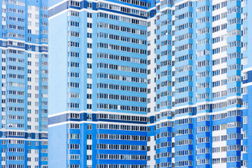 Residential complex, building background. Modern high-rise building, new building in blue colors